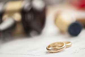 wedding rings next to gavel