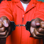orange jumpsuit with handcuffs