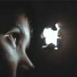 child looking through hole
