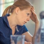 stressed looking at laptop